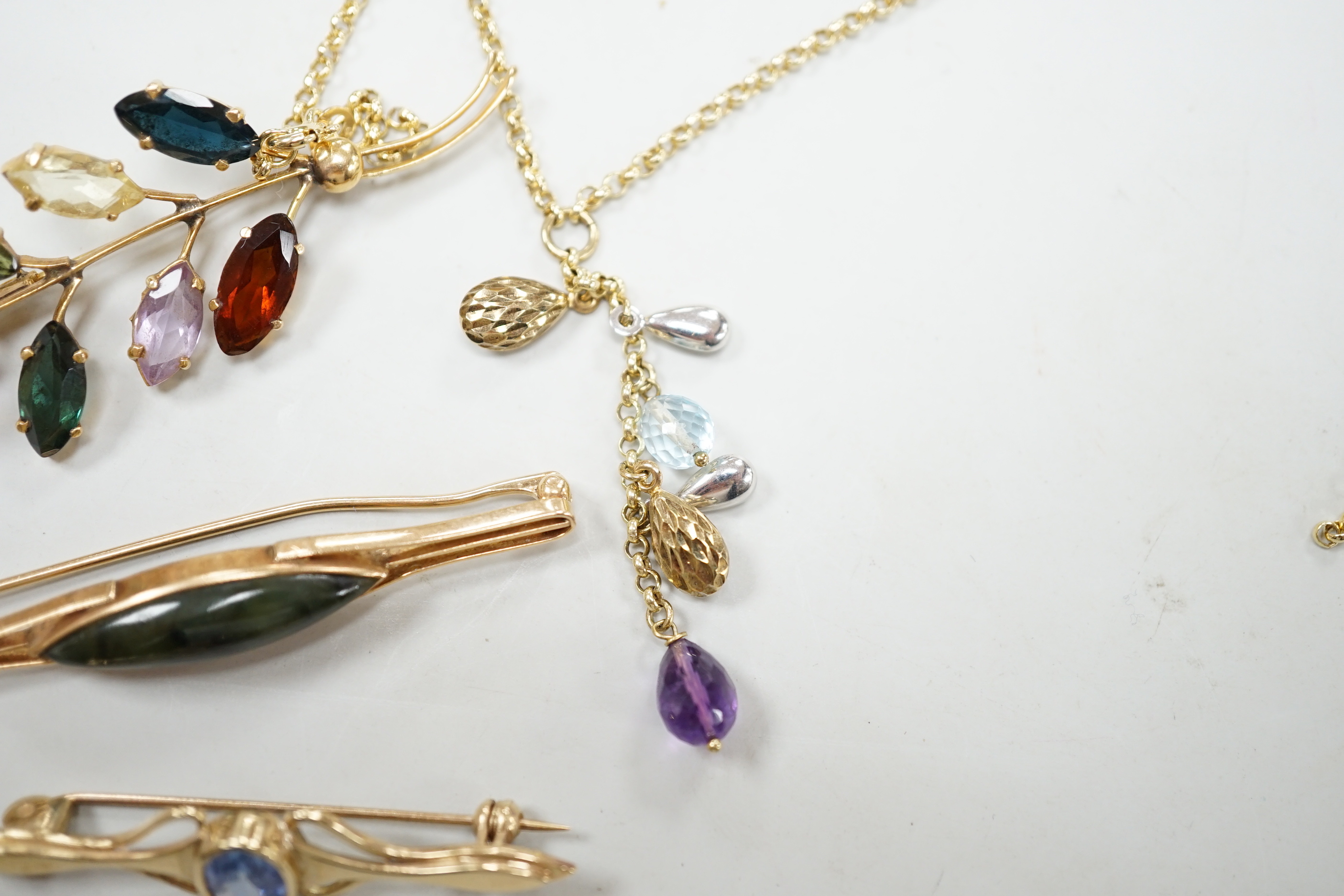 Three modern yellow metal and gen set brooches including 9ct gold and a modern 9ct gold and gem set necklace, gross weight 16.8 grams.